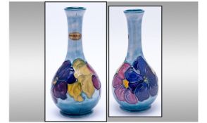 Moorcroft Bottle Shaped Vase 'Clematis' Design on Powder Blue Ground. Excellent condition. Moorcroft