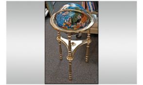 A Floor Standing Blue Lapis Gem Stone World Globe. Height 37 inches. Heavy floor standing, gold
