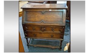 Early 20th Century Oak Bureau, moulded fall front with fitted interior above two short and one