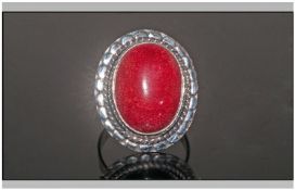 Red Coral Hand Made Solitaire Ring, the cabochon cut oval coral of over 10cts held in a sterling