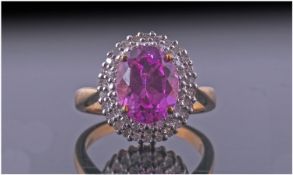 Ladies 9ct Gold Set Diamond And Pink Stone Cluster Ring. Fully hallmarked. The central pink stone