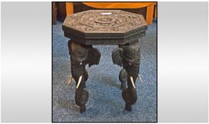 Small Burmese teak wood octagonal shaped elephant stool
Profusely carved top with elephant shaped