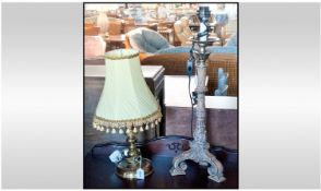 Two Modern Lamps, one with brass stem and yellow shade, 20 inches in height. Another candle stick