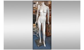 Life Size Female Mannequin, movable body and arms, raised on pole, standing on square base.  .