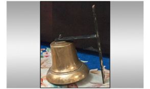 A Mounted Bronze Ships Bell on an iron bracket. Unnamed. The bell measures 9 inches.