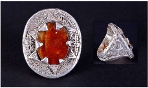 A Large Silvered Metal Middle Eastern Ring, with a large agate type stone to the centre with ethnic