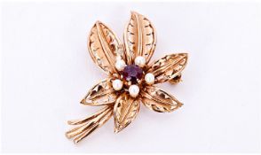 9ct Gold Garnet And Pearl Flower Design Brooch. Fully hallmarked. 1.5 inches high. 5.9 grams.