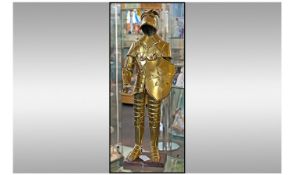 Tall Bronze Effect Figure Of A Knight`s Full Suit Of Armour, Holding A Shield. Raised on a wooden