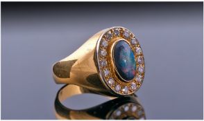 18ct Gold Black Opal And Diamond, Set with a Central Solid Black Opal Showing Flashes Of Greens,