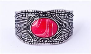 Rhodochrosite and Marcasite Cuff Bangle, an oval cabochon of the deep pink and white swirled