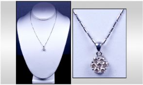18ct White Gold Set Diamond Cluster Pendant Flowerhead Setting. Marked 750. Fitted on a 9ct white