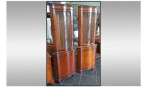 A Pair of Modern Reproduction Mahogany Veneered Glazed Top Corner Cabinets with cupboards below,