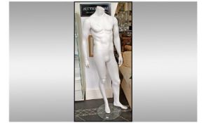 Life Size Male Mannequin, movable body and arms, raised on pole, standing on circular.