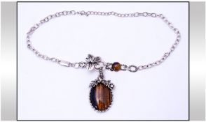 Tiger Eye Butterfly and Flower Asymmetric Pendant Necklace. The oval tiger eye pendant decorated