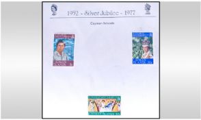 Two Red Albums full of Mint Commonwealth Silver Jubilee Stamps.