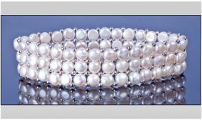 Ivory White Cultured Button Pearl Bracelet comprising three rows of button pearls threaded onto