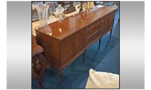 Contemporary, Rosewood Sideboard.  A bank of 3 drawers to the centre and cupboards either side,