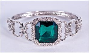 Art Deco Style Deep Emerald and White Crystal Bangle, large deep green cushion cut crystal within a
