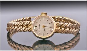 Tissot Ladies 9ct Gold Cased Wrist Watch. With integral 9ct gold basket weave bracelet. Fully