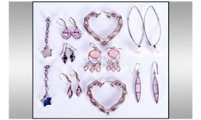 Nine Pairs Of Silver Earrings.