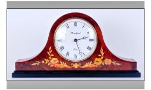 Quartz ``Woodford`` Mantel Clock. White dial with Roman numerals. Floral decoration to front of