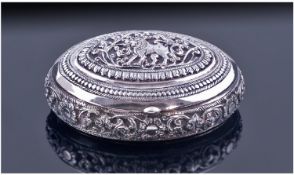 A Heavy Quality Oriental Silver Oval Box. The domed lid decorated in rich relief with a lion