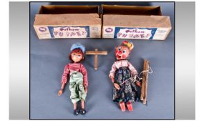 Two Boxed Boy and Girl Pelham Puppets comprising Standard Puppet  and Simple Dancing Puppet, both