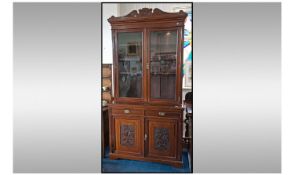 Late Victorian Mahogany Glazed Top Book Case, with cupboards below and two draws with carved parrel