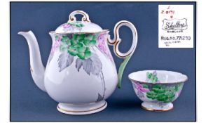 Shelley Small Teapot and Sugar Bowl, pink and green blossom with grey foliage on a white ground,