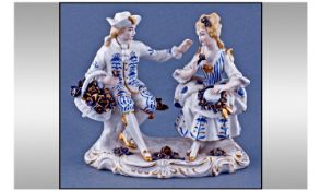 Sitzendorf Figure ``Courting Couple`` in 18th century dress. Circa 1910. Height 5 1/8 inches.