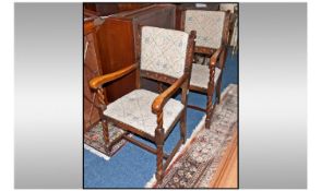 A Pair Of Jacobean Style Oak Candy Twist Arm Chair, with carved side slats to the back, covered in