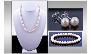 Ivory White Fresh Water Pearl Set comprising hand knotted necklace,18 inches long, fastened with a