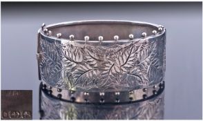 Victorian Broad Hinged Bangle. Front with Engraved Leaf Decoration And Bauble Edge. Fully