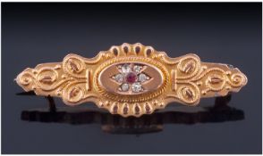 9ct Gold Pressed Brooch. With Central Paste Set Stones, with Wire Work Design. Stamped 9ct.