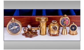 Small Fitted Hinged Box Containing Six Miniature Brass Nautical Items.