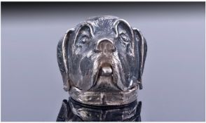 An Unusual Silver Pill Box, designed as the head of a hound with its tongue lolling out. Depressing