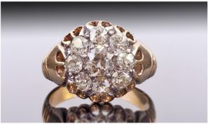 18ct Gold Diamond Cluster Ring. Set With A Larger Central Round Cut Diamond Surrounded By 8 Smaller