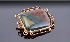 Early 20th Century Moss Agate Brooch. Mounted in a Yellow Metal Rectangular Mount with Wire Scroll