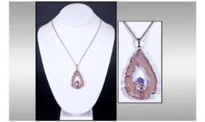 White Metal Framed Pendant, Mounted with Agate and Amethyst. Of Free Form Design Suspended on a