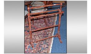 A Victorian Style Towel Rail, on shaped cabriole legs.