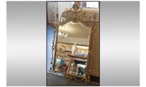 Brass Framed Mirror. Size 37 x 22 inches.