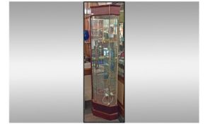 Mahogany Corner Display Unit with glass shelves and electric lights.