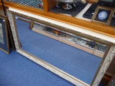 Large Overmantle Mirror, the frame with acanthus scrollwork, with bevelled edge, 28½ inches high,