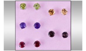 Five Pairs of Gemstone Stud Earrings, each claw set, round cut stones, comprising amethyst,