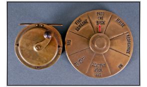 Comical Brass Games Counter. Together with a Unmarked Brass Fishing Reel.