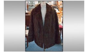 Ladies Dark Brown Short Length Mink Jacket. Fully lined. Hook and loop fastener. Approximate size