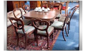 French Late Nineteenth Century Walnut Extending Dining Table on four heavy turned legs attached to