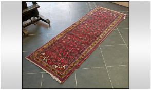Afghan Wool Runner Rug. 77 by 27 inches. Predominantly red in colour with gold border.