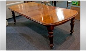 A Late Victorian Mahogany Reeded Leg Large Dining Table with winder, and rounded ends. Two loose