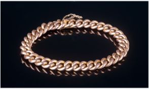 Edwardian 9ct Gold Curb Bracelet, with safety chain. Marked 9ct. 13.6 grams. Good condition.